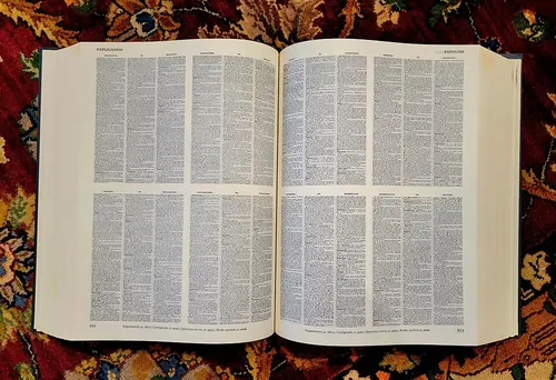 A view inside the Compact Oxford English Dictionary, showing how the content of four pages of the full sized edition are duplicated on one p